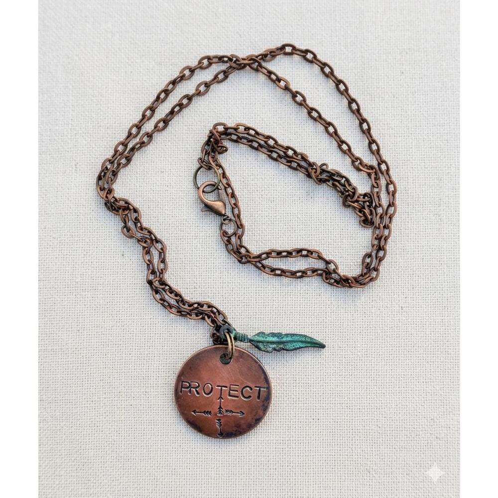 PROTECT-hand stamped copper-patina feather